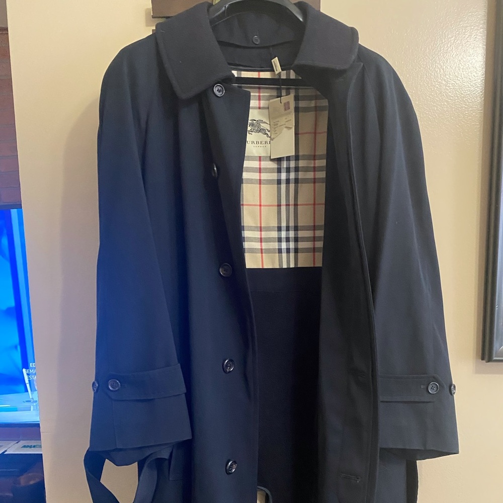 Authentic Beautiful black Burberry rain coat new with tags.
